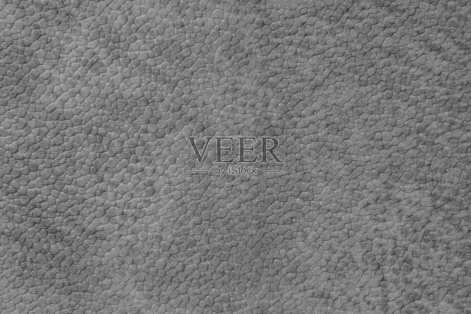 灰色绒面革的特写,仿皮革表面带有自然卵石纹理图案照片摄影图片