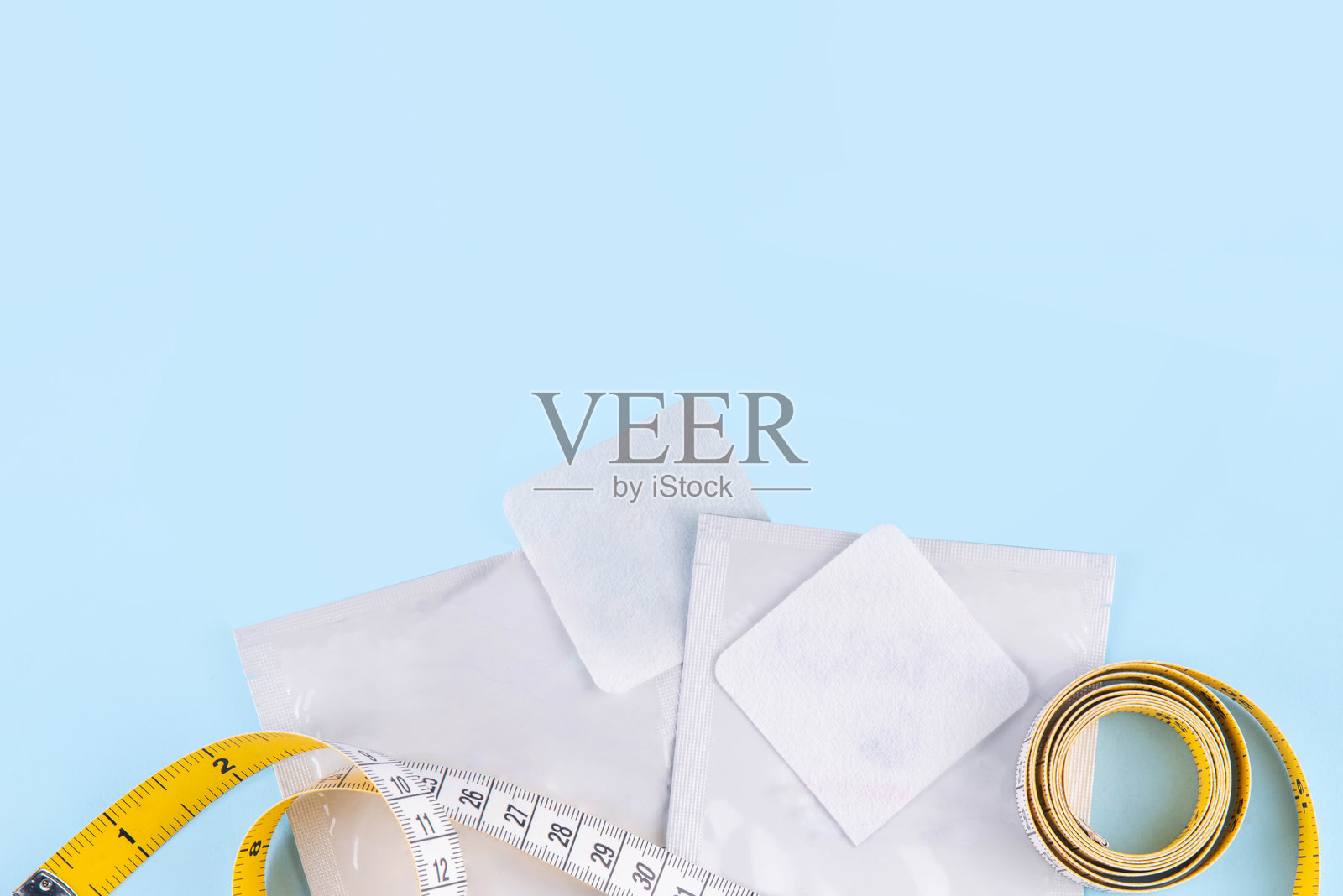 纤薄的代谢贴片与卷尺照片摄影图片