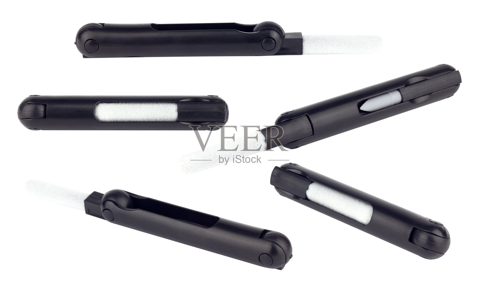 一套用于清洁耳机的多功能工具,折叠式,背景隔离。照片摄影图片