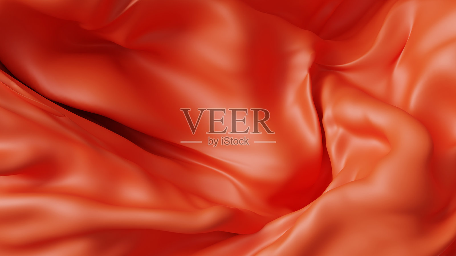 背景图像中飘动的布料呈现出大胆的橙色和图案。照片摄影图片