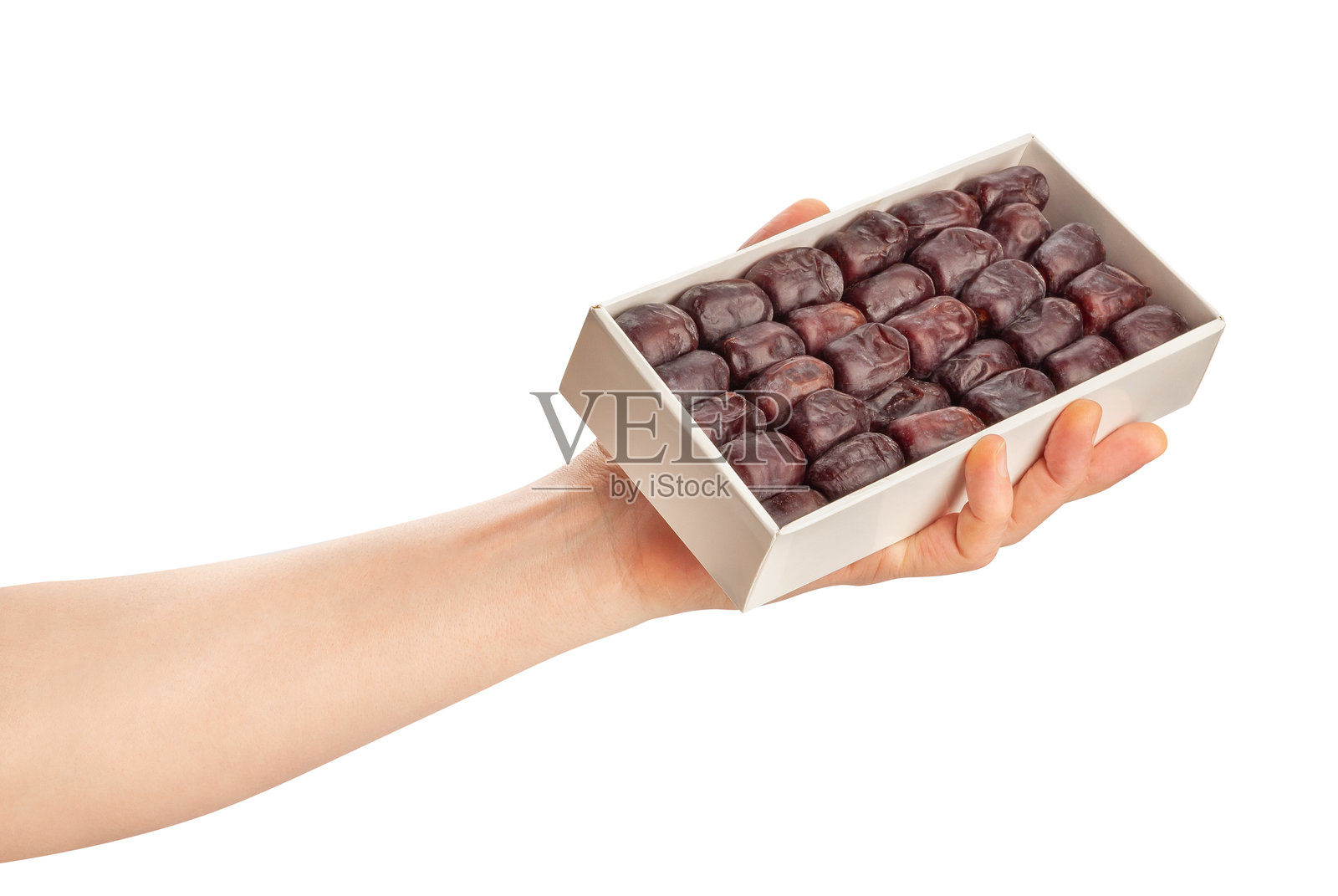 手中握着的枣子照片摄影图片