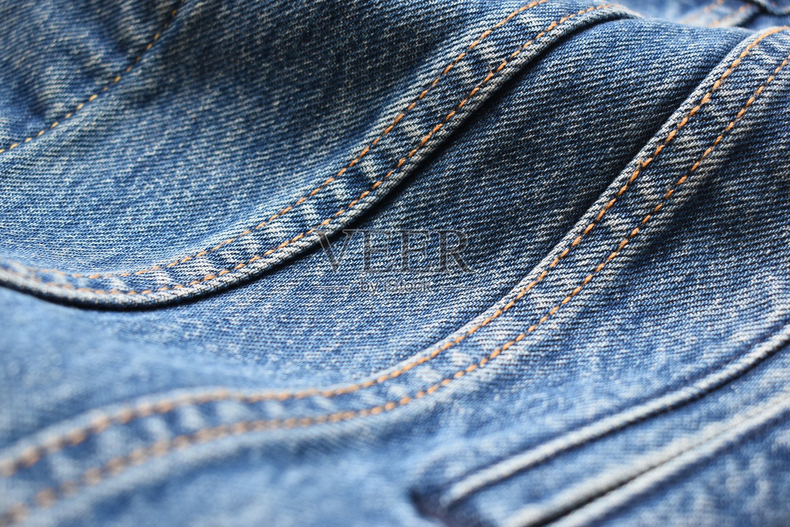蓝色牛仔布纹理背景,牛仔时尚风格照片摄影图片