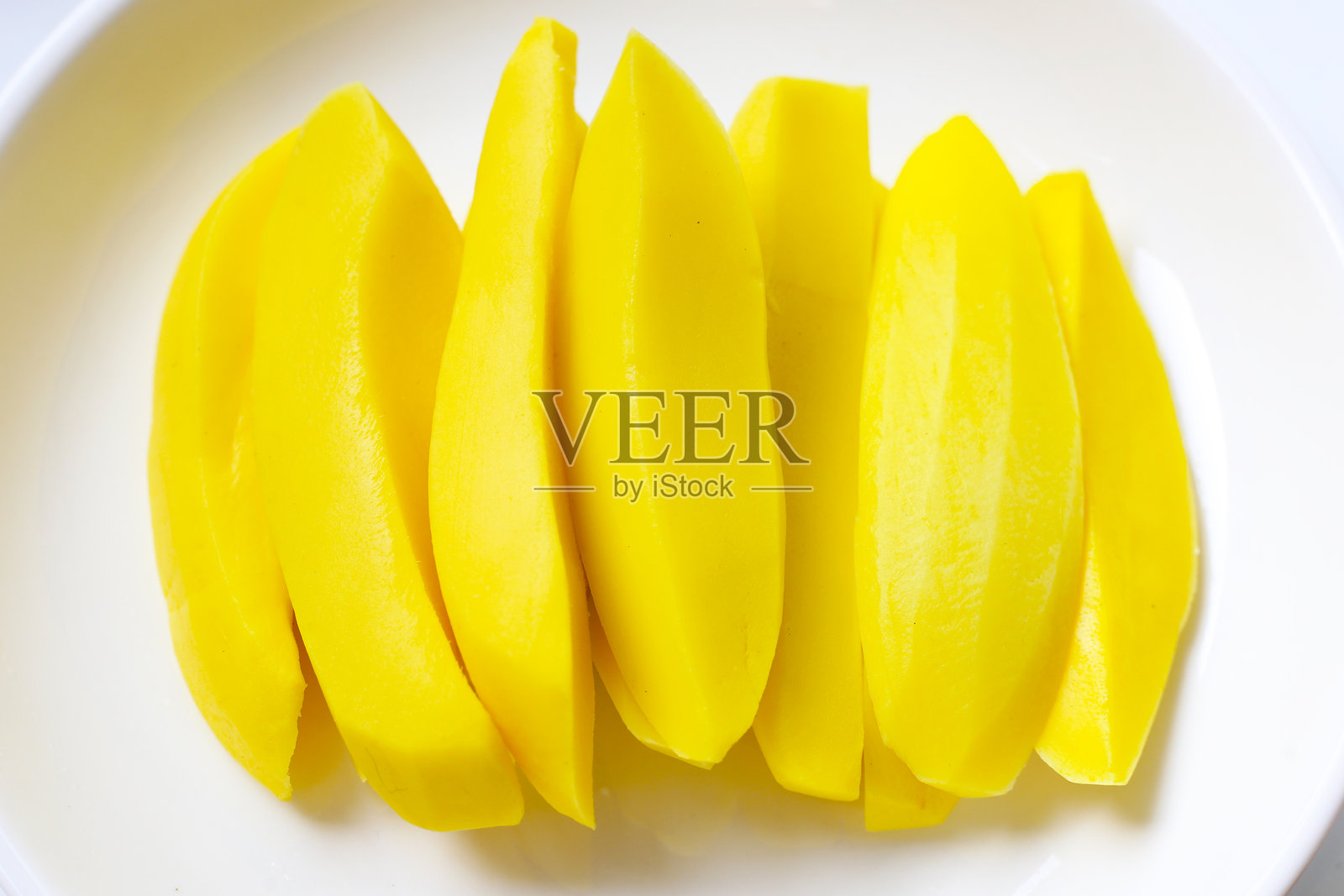 腌制的芒果片,甜脆可口照片摄影图片