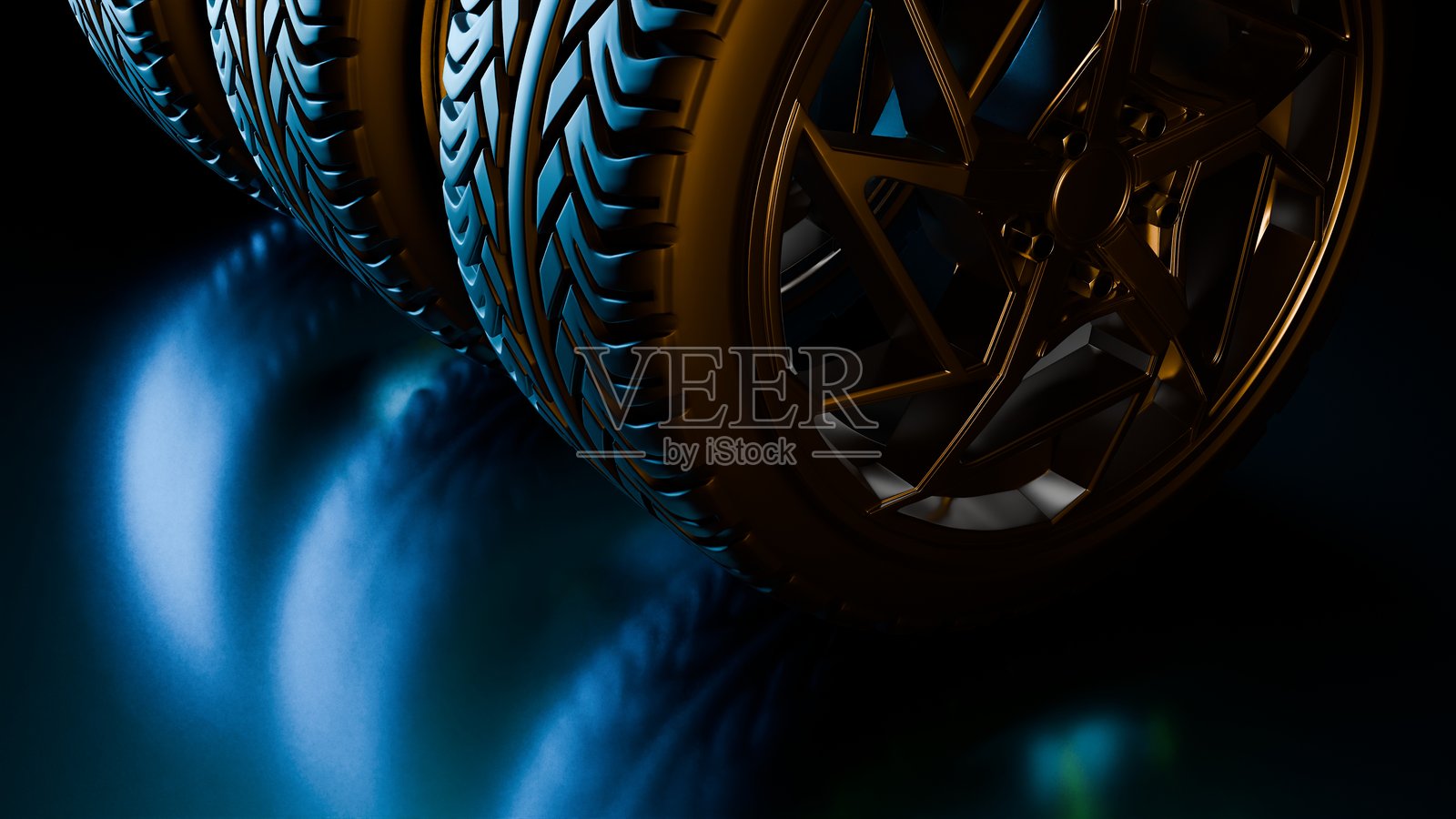 一排带金色轮辋的汽车轮胎,放在光滑的黑色地板上,散发着蓝色光芒。照片摄影图片