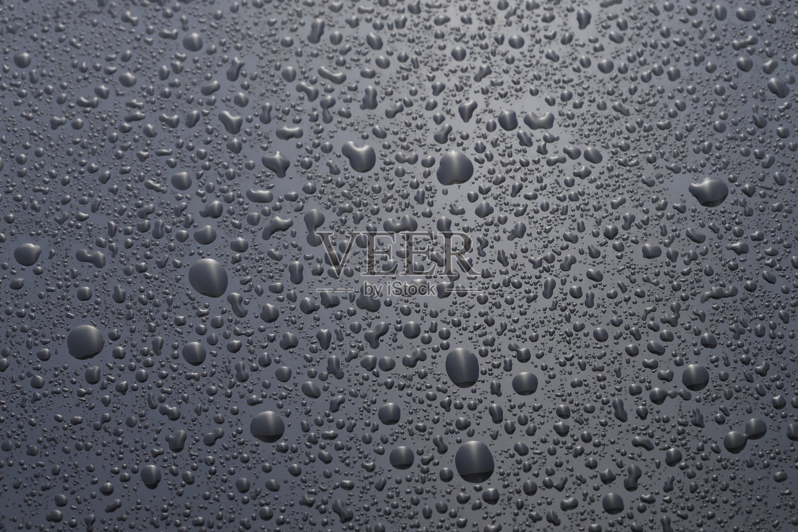 灰色玻璃表面的水滴,俯视角度照片摄影图片