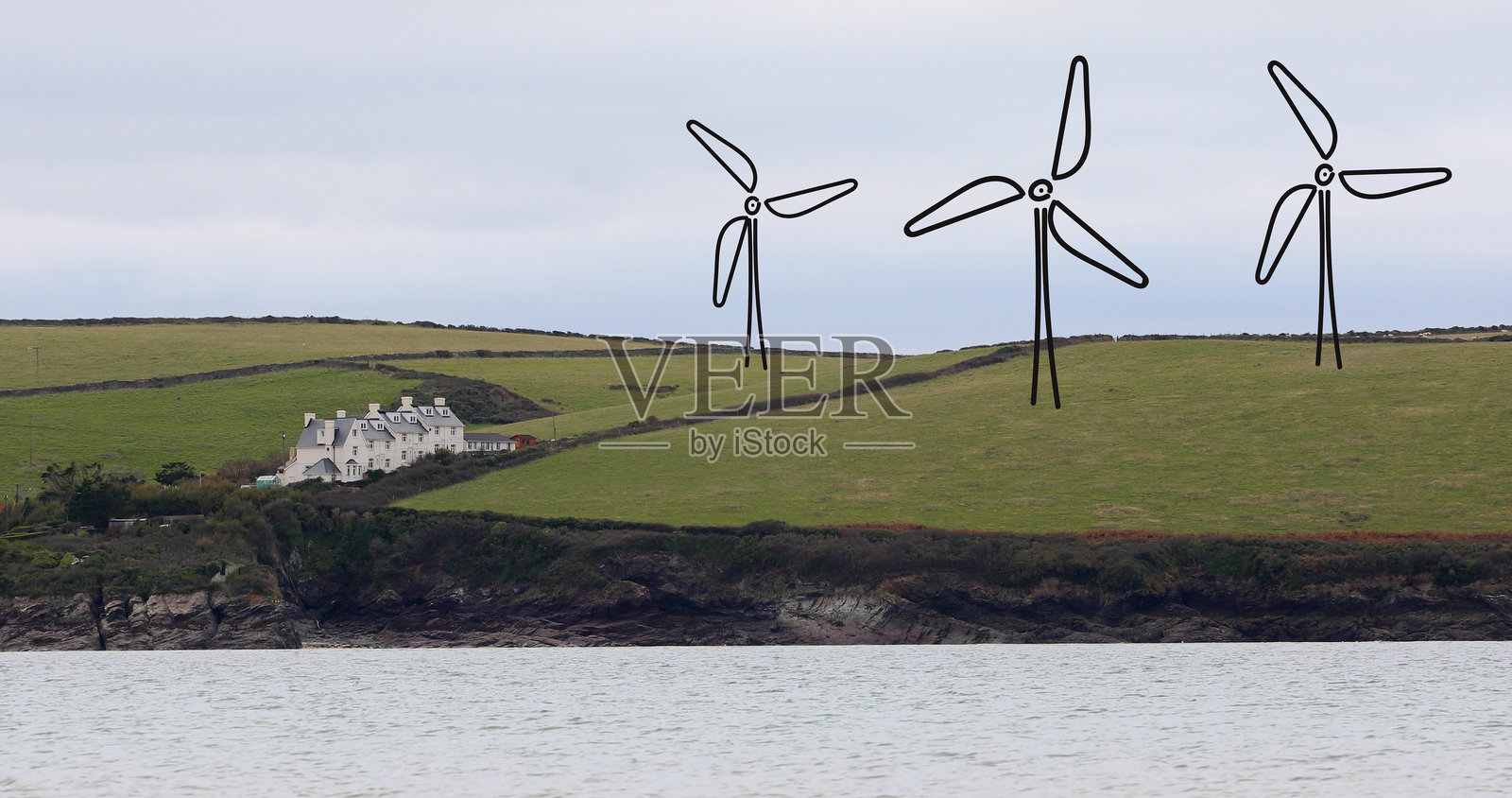 海边山坡上手绘风力涡轮机照片摄影图片