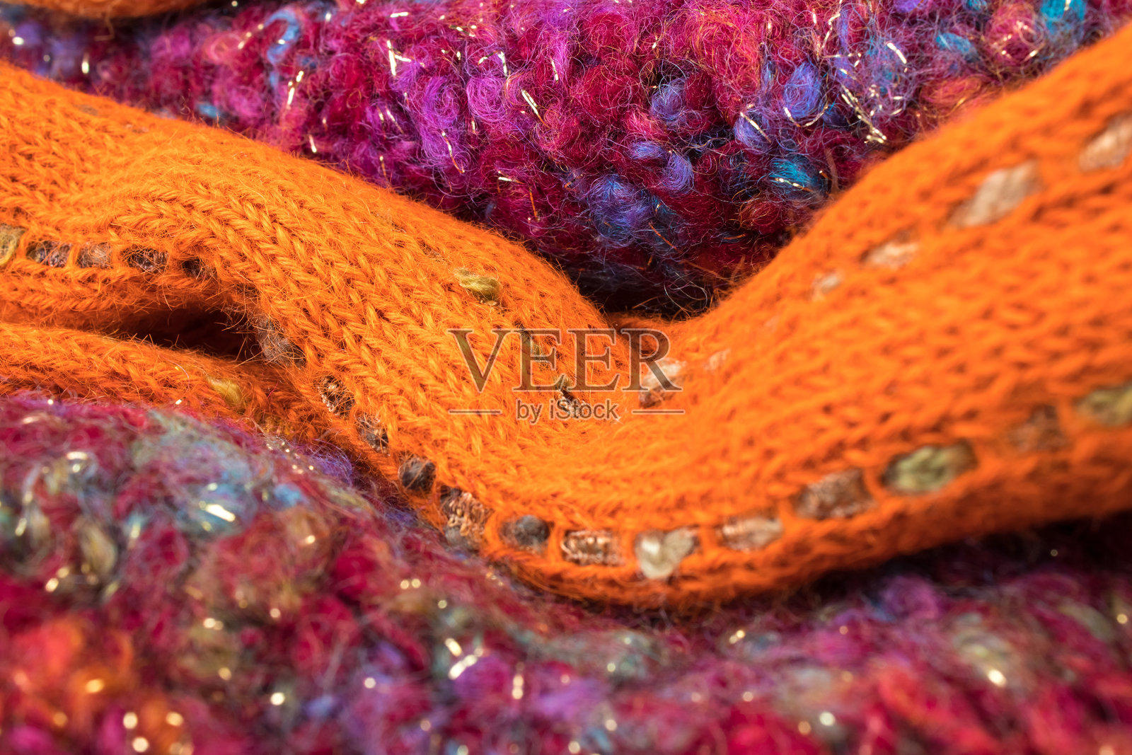 针织羊毛衫。一堆针织冬装、秋装、毛衣、针织品,留有文字空间。照片摄影图片