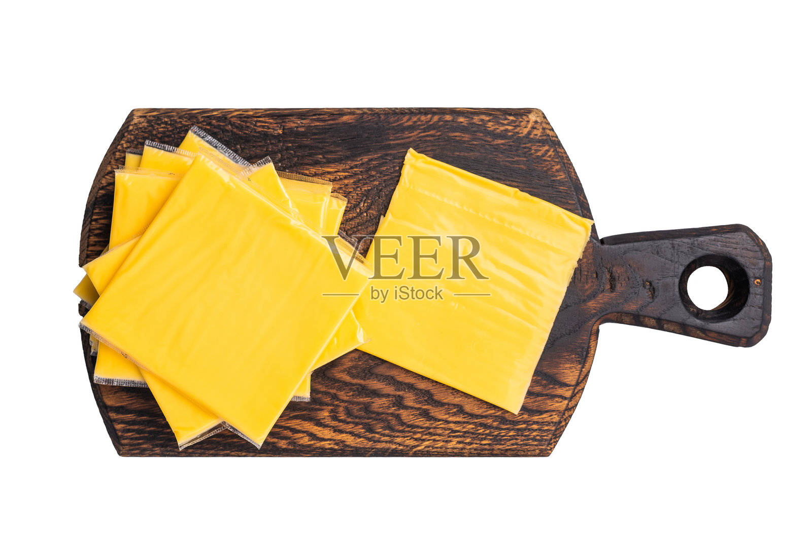 加工过的融化芝士,薄片用于三明治,孤立在白色背景上照片摄影图片