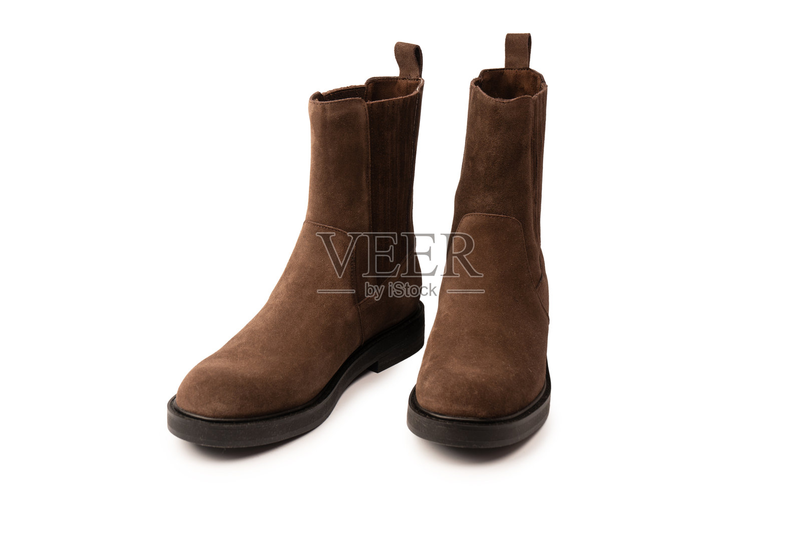 棕色皮靴,孤立在白色背景上。照片摄影图片