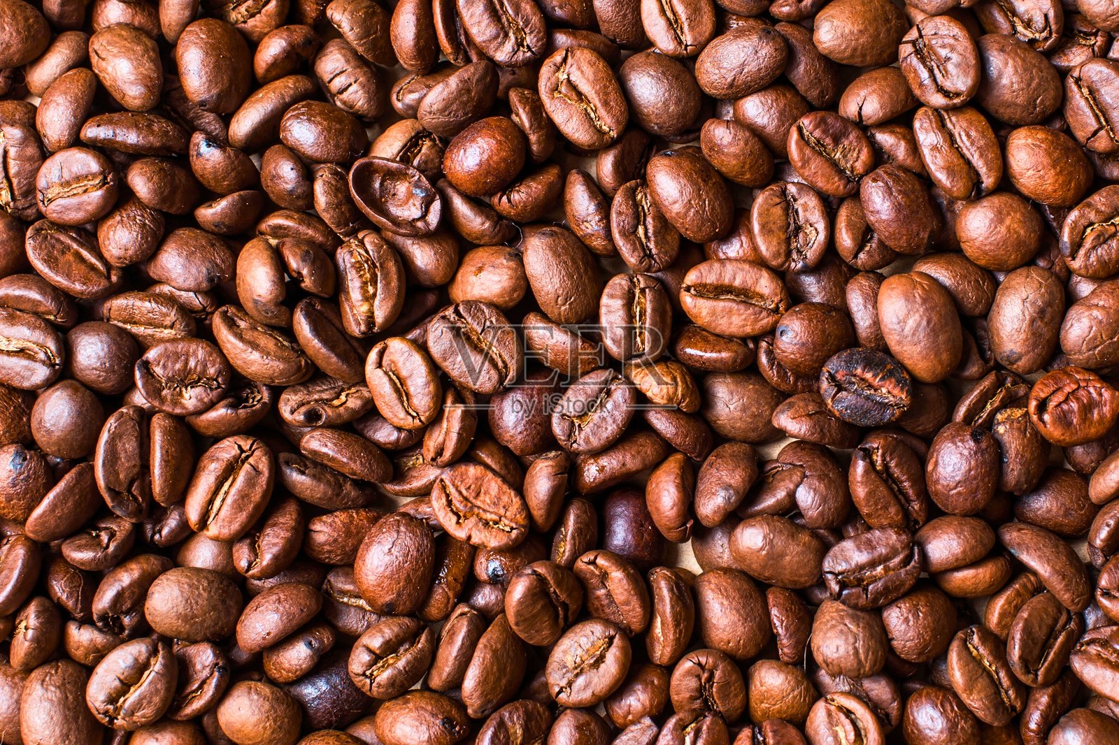 烤咖啡豆纹理背景的特写微距视图照片摄影图片