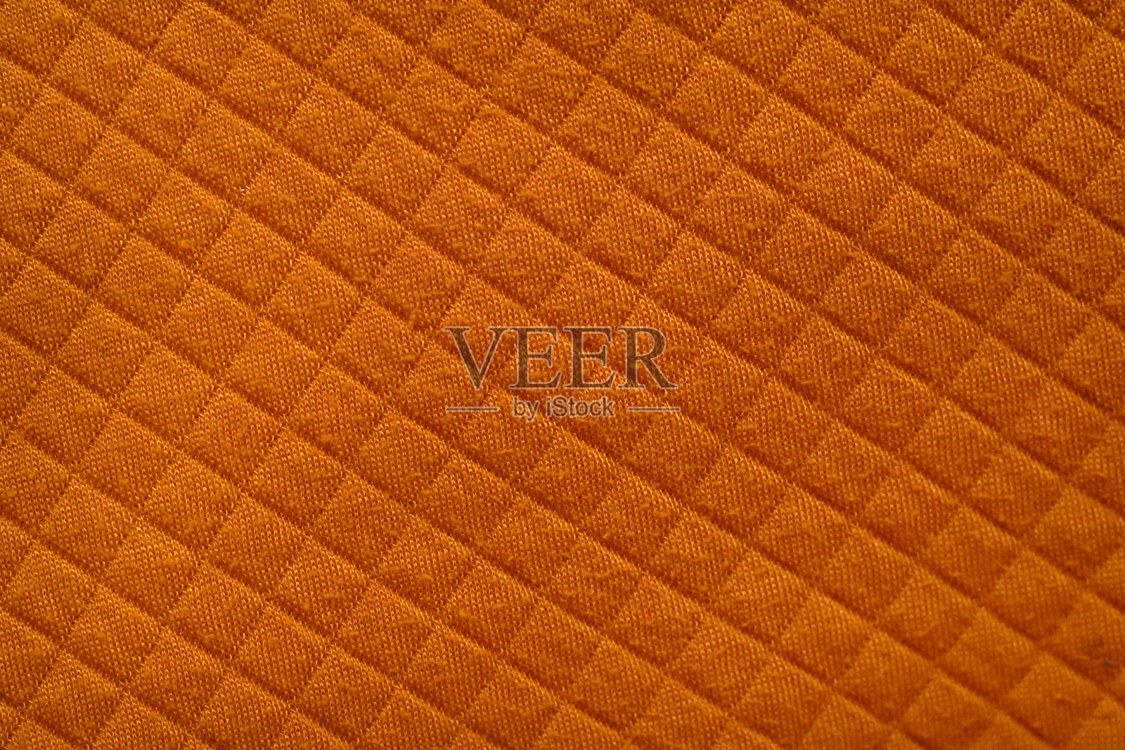橙色菱形格纹绗缝面料特写照片摄影图片