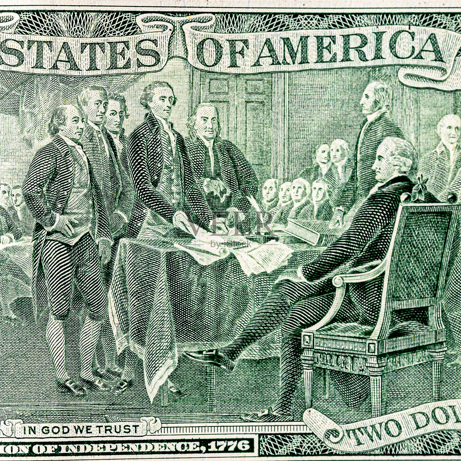 多张两美元纸币的细节特写,上面印有托马斯·杰斐逊的肖像,纸币相互重叠。美国两美元纸币特写。照片摄影图片