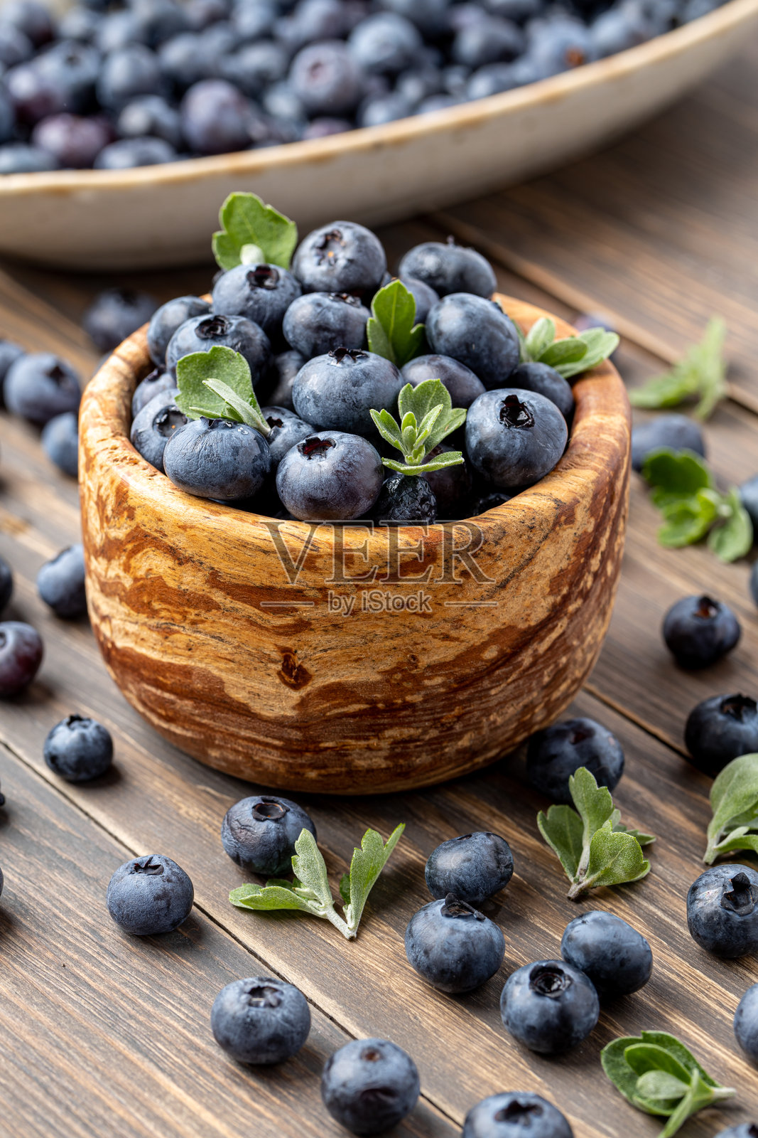 新鲜蓝莓背景。蓝莓纹理特写。蓝莓抗氧化有机超级食物碗概念。健康营养。照片摄影图片