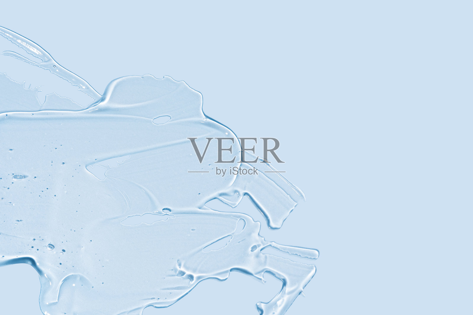 化妆品凝胶质感飞溅样本。化妆品凝胶产品近景含气泡。面部啫喱精华、洁面乳、沐浴露或洗发水照片摄影图片