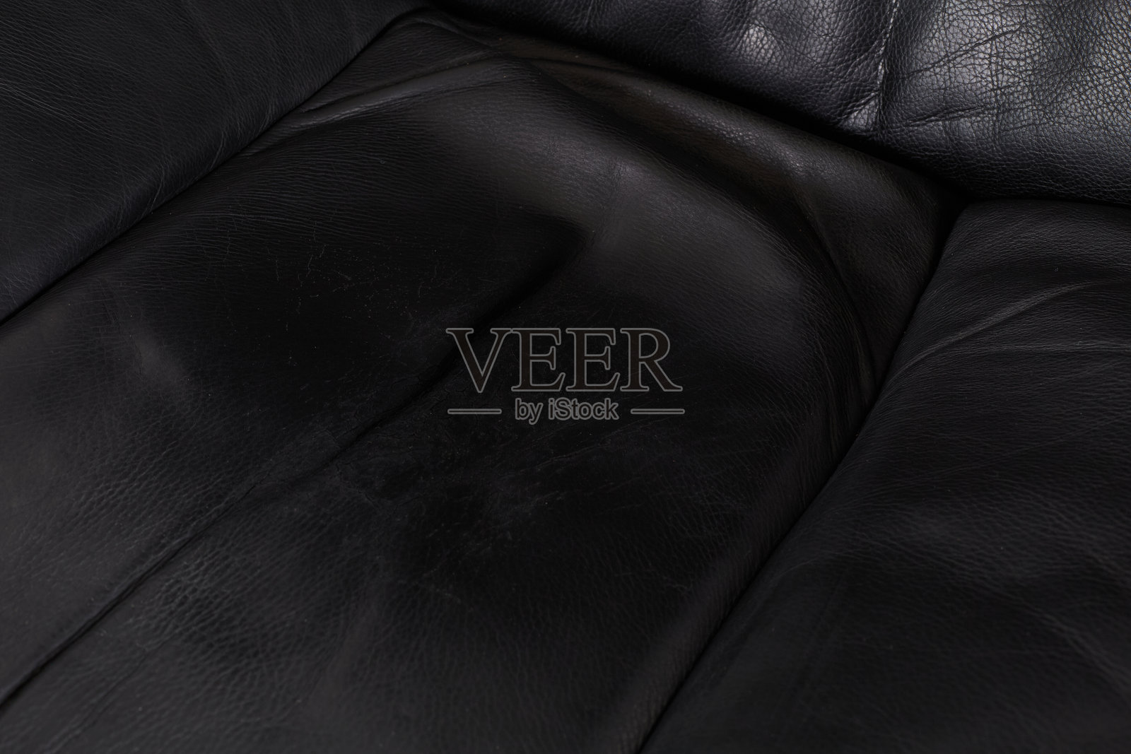 黑色皮革躺椅和脚凳的细节照片摄影图片