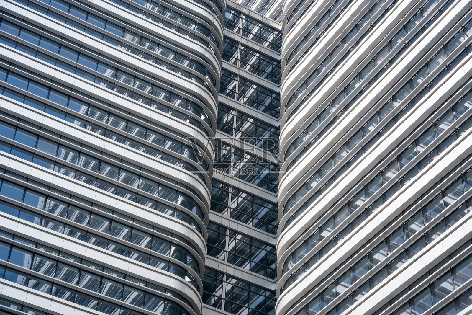 现代高层建筑弧形玻璃幕墙特写照片摄影图片