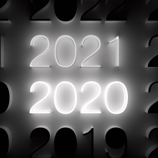 发光的2021年和2020年的数字在墙上。新年的概念图片 发光的2021年和2020年的数字在墙上。新年的概念图片下载