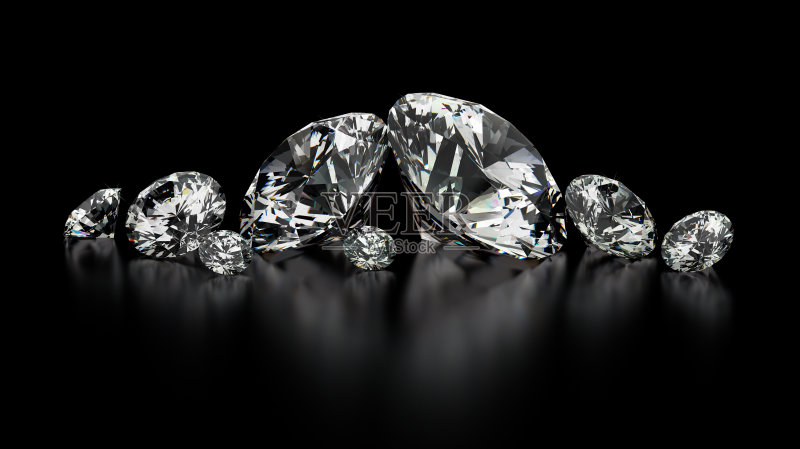 黑色背景上有几颗大小不一的钻石正版图片素材