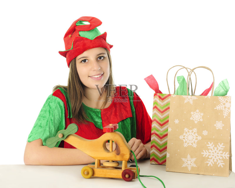 礼物桌子后面的精灵正版图片素材