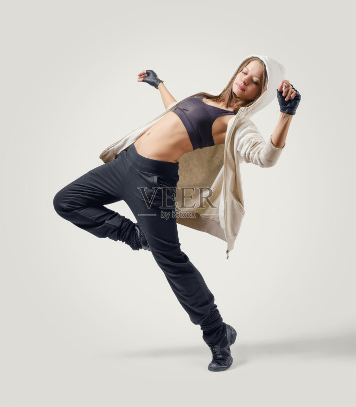 年轻的女孩舞者跳爵士舞的位置正版图片素材