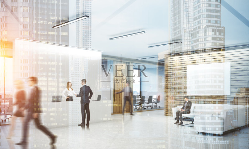 同事在繁忙的办公室大厅正版图片素材