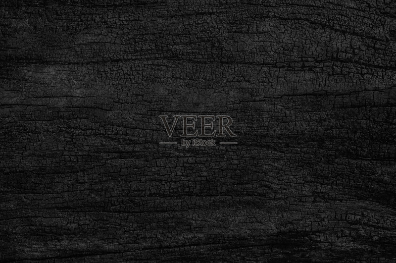 黑色的狼籍的背景。燃烧木材纹理。正版图片素材