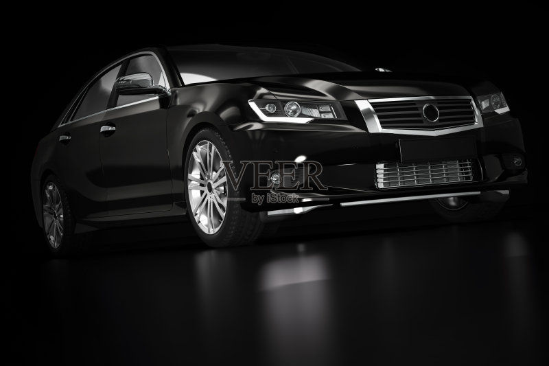 现代黑色金属轿车在聚光灯下。通用设计,brandless。正版图片素材