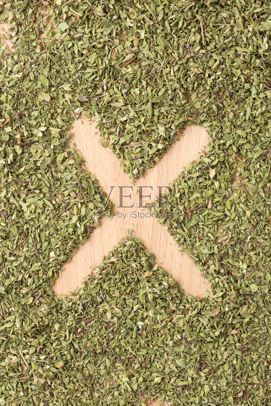 用牛至写的字母X照片摄影图片