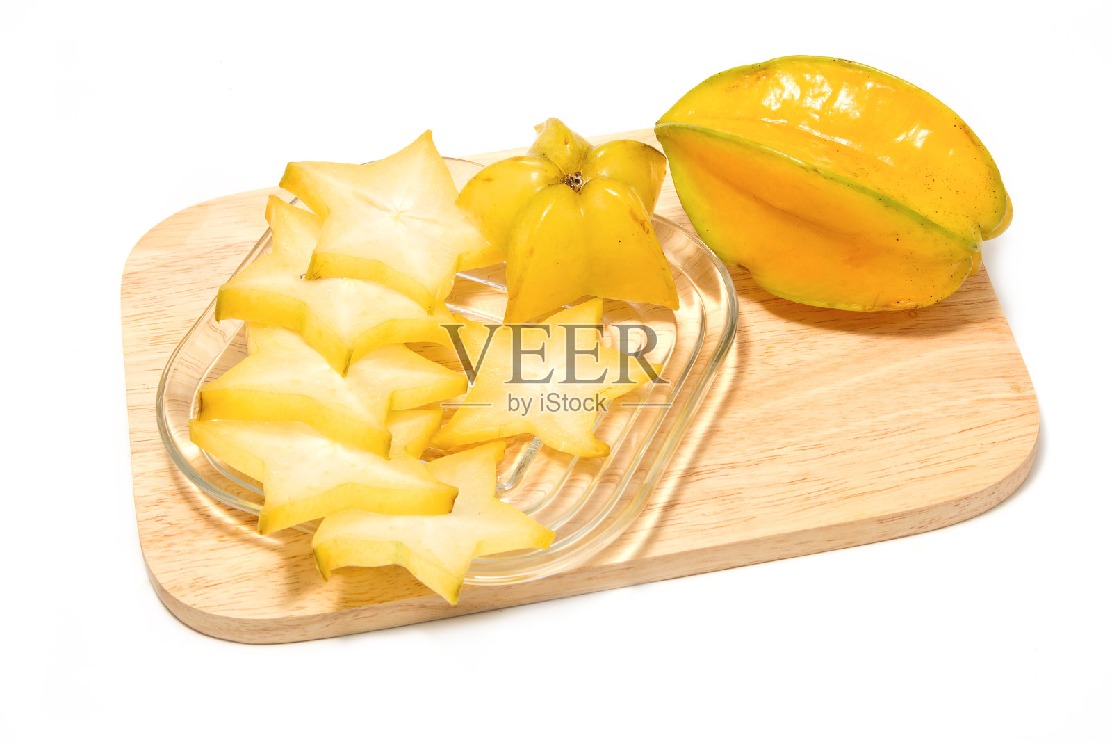 杨桃切片在木板上照片摄影图片