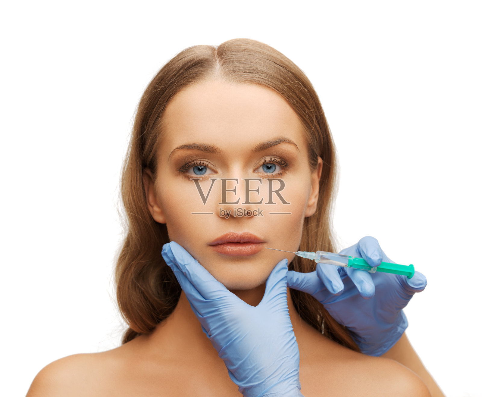 女人的脸和美容师的手与注射器照片摄影图片