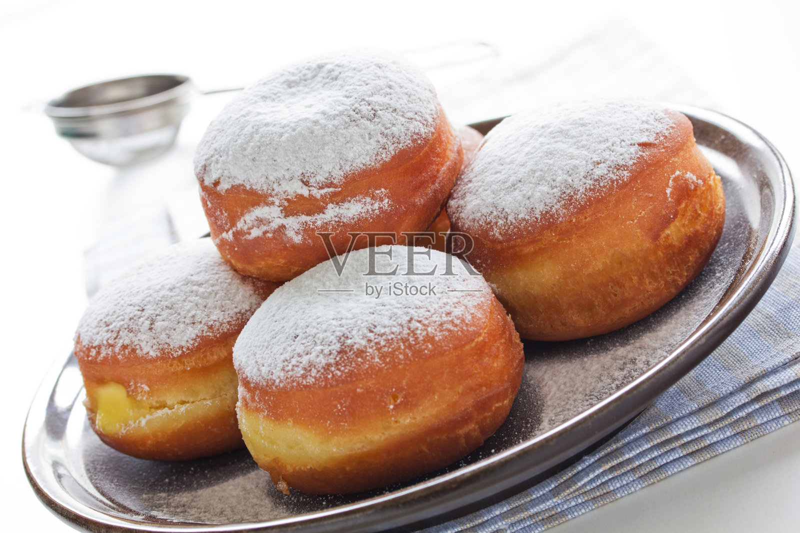 甜甜圈加糖粉。照片摄影图片