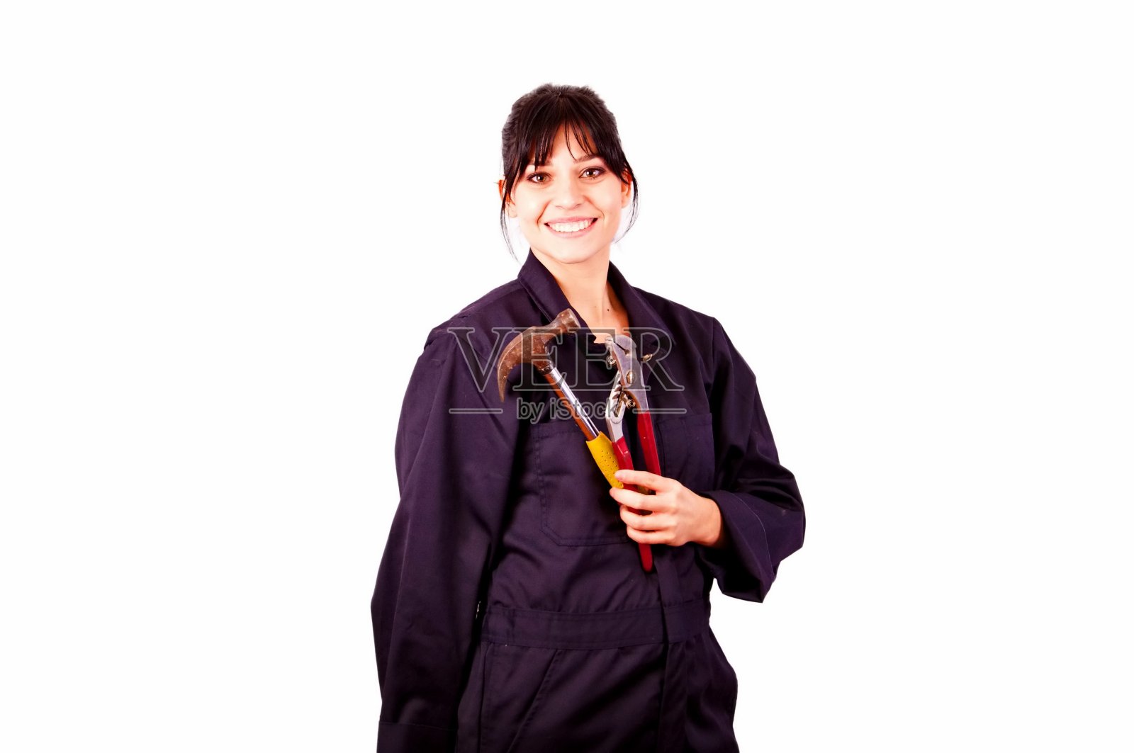 漂亮的棕色头发，带着蓝色和工具微笑的女人照片摄影图片