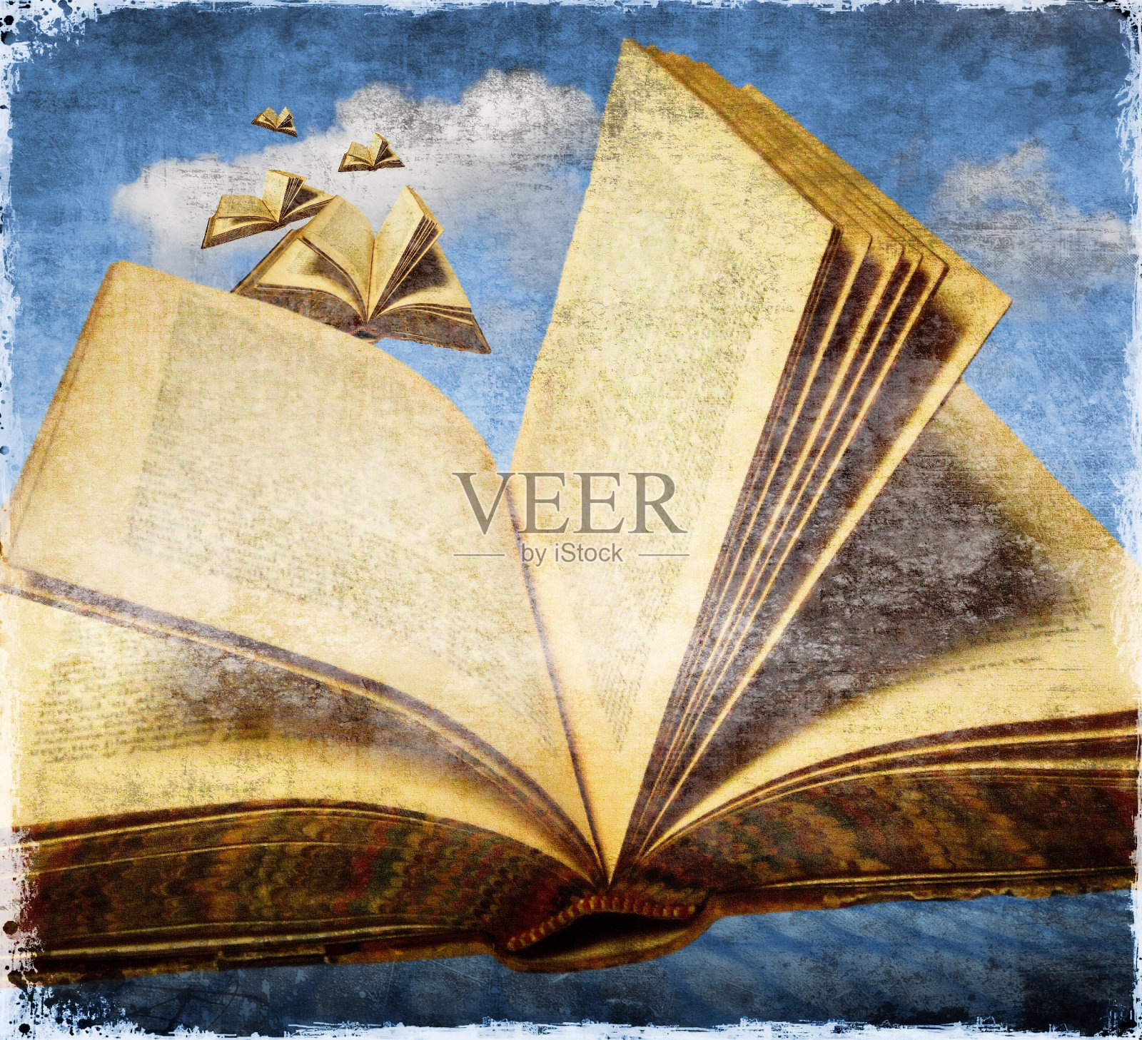 翻开的旧书在天空中飞舞。照片摄影图片