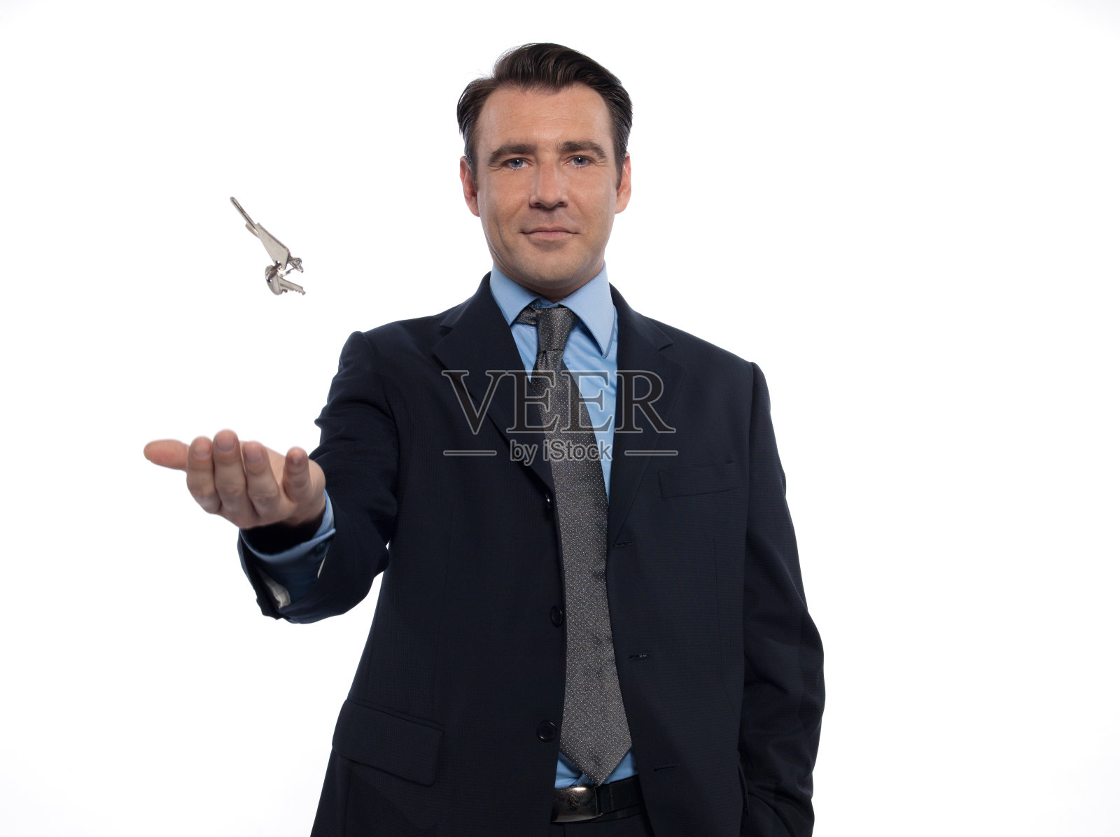 商人房地产经纪人扔钥匙照片摄影图片