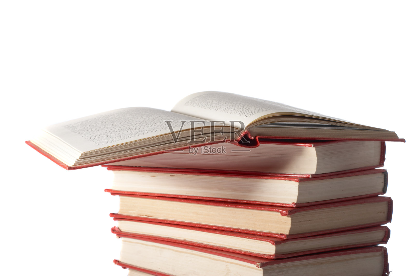 红色的书立在白色的背景上照片摄影图片