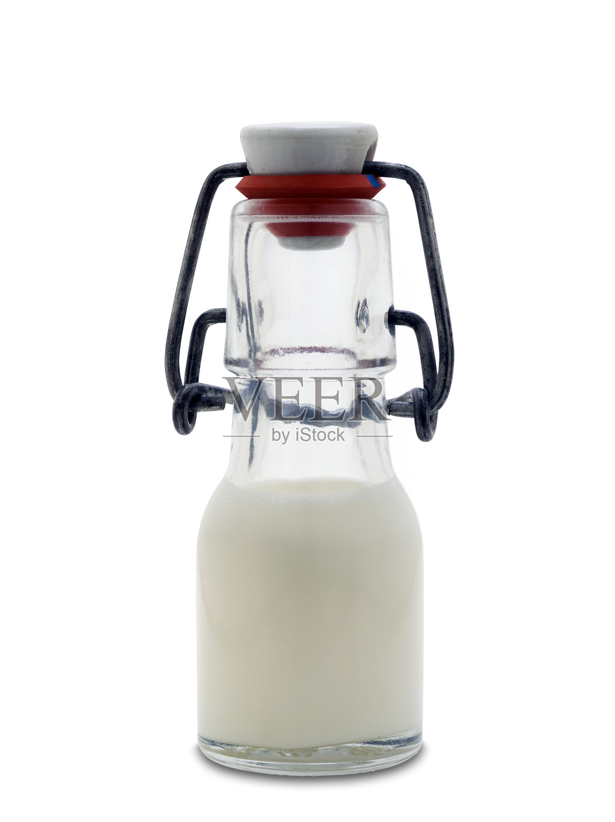 盛满牛奶的小玻璃瓶(夹道)照片摄影图片