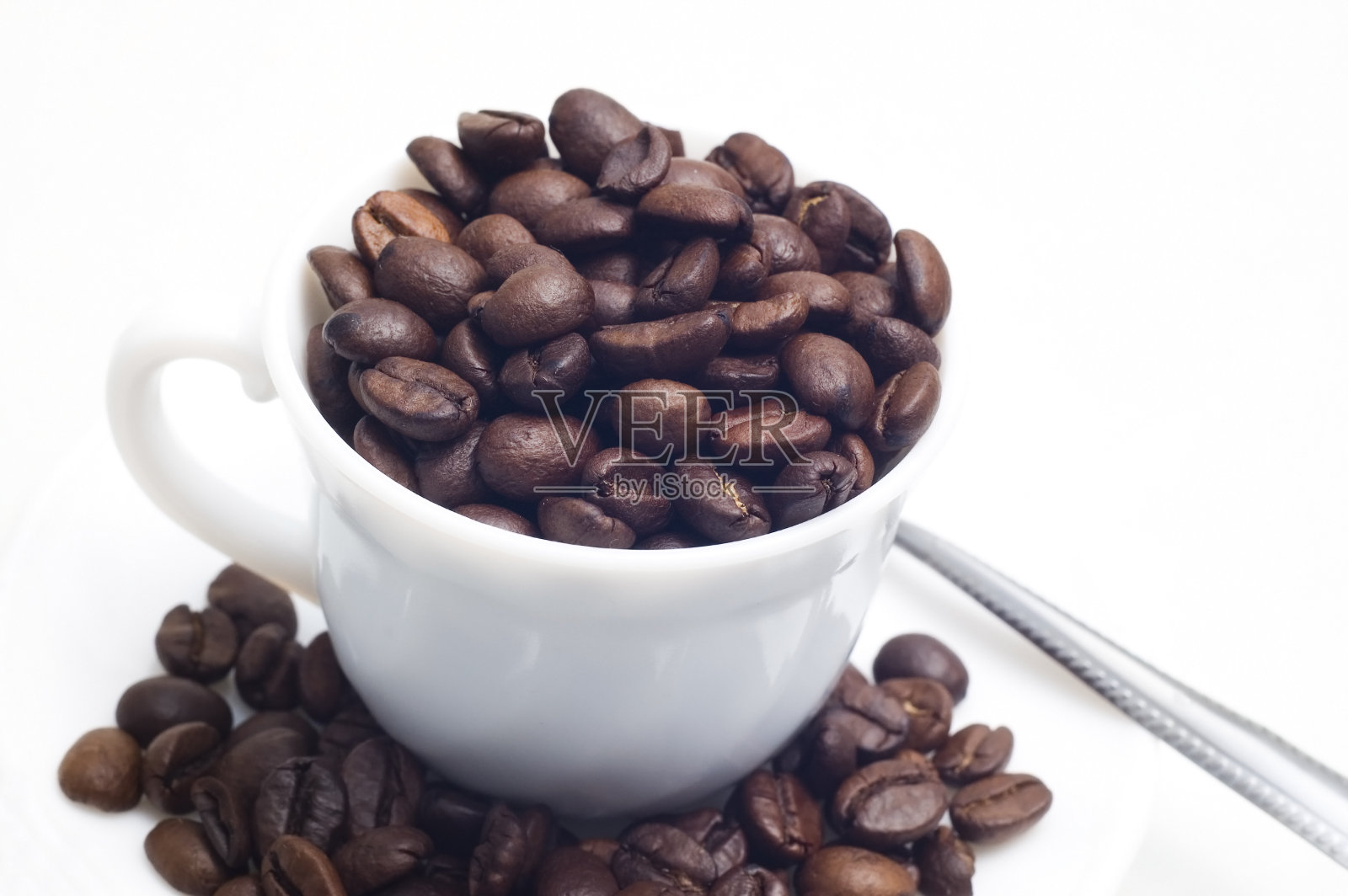 杯子和咖啡豆照片摄影图片