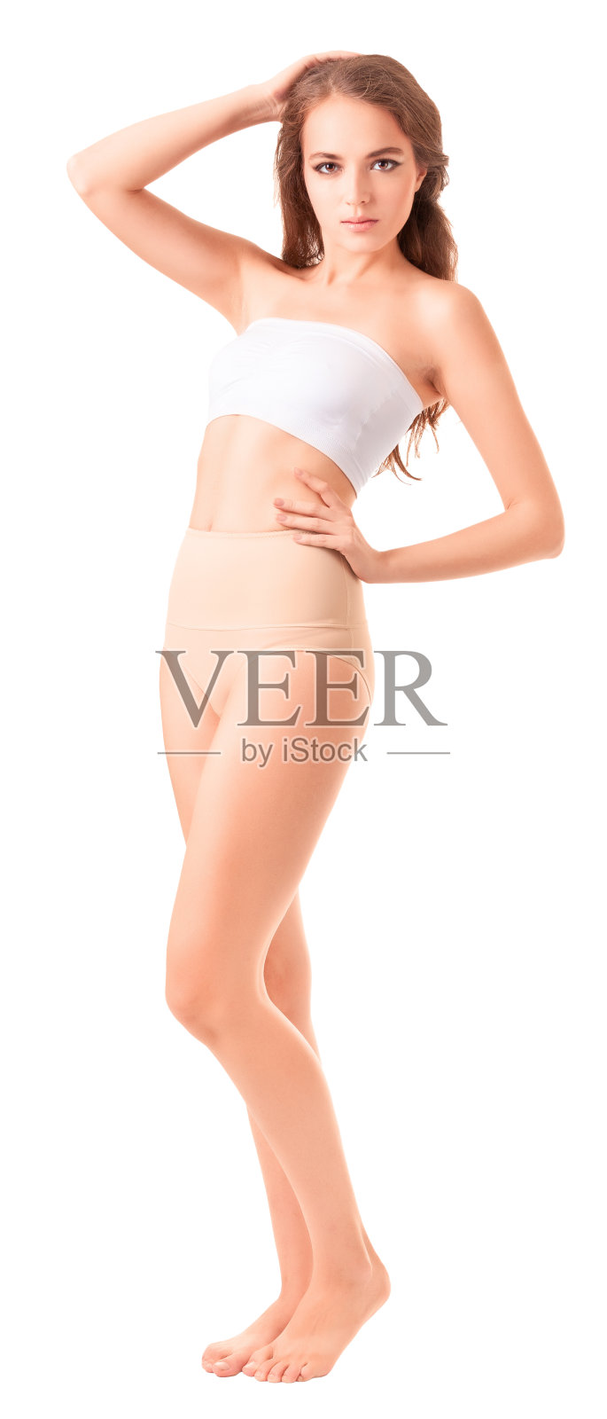 年轻苗条的女人在白色背景下摆姿势照片摄影图片