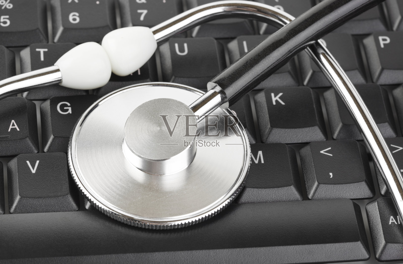 听诊器和电脑键盘照片摄影图片