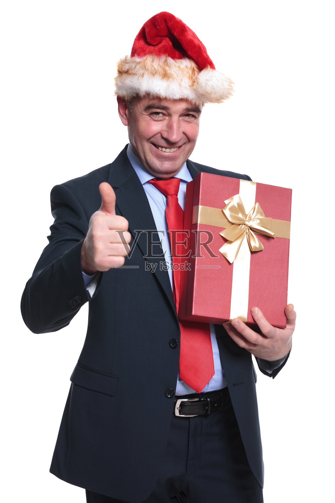 商人圣诞老人拿着礼物，做出ok的手势照片摄影图片