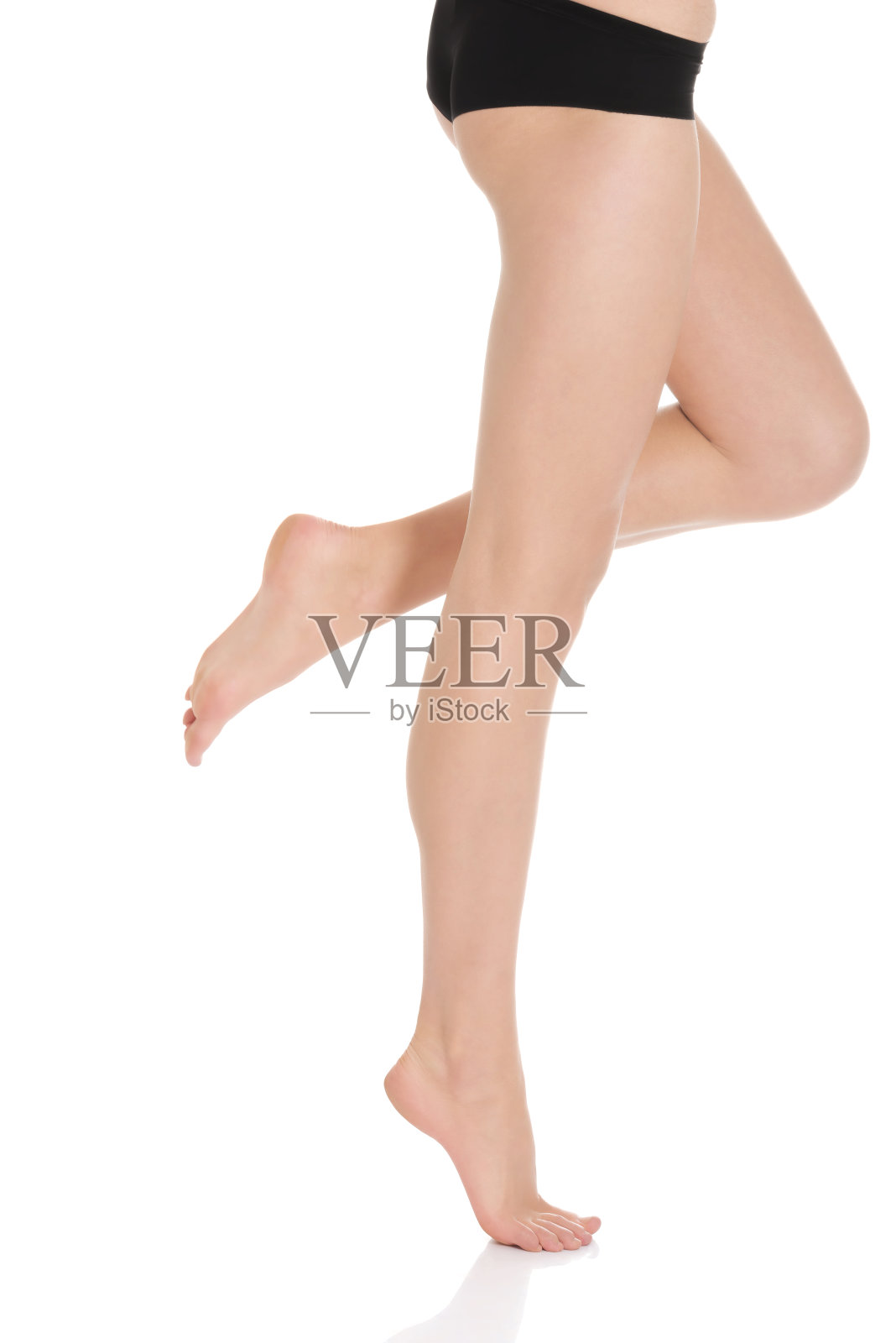 女人完美柔软的长腿。照片摄影图片