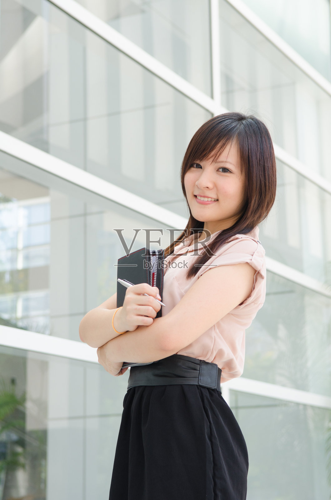 亚裔华裔女学生穿正装照片摄影图片