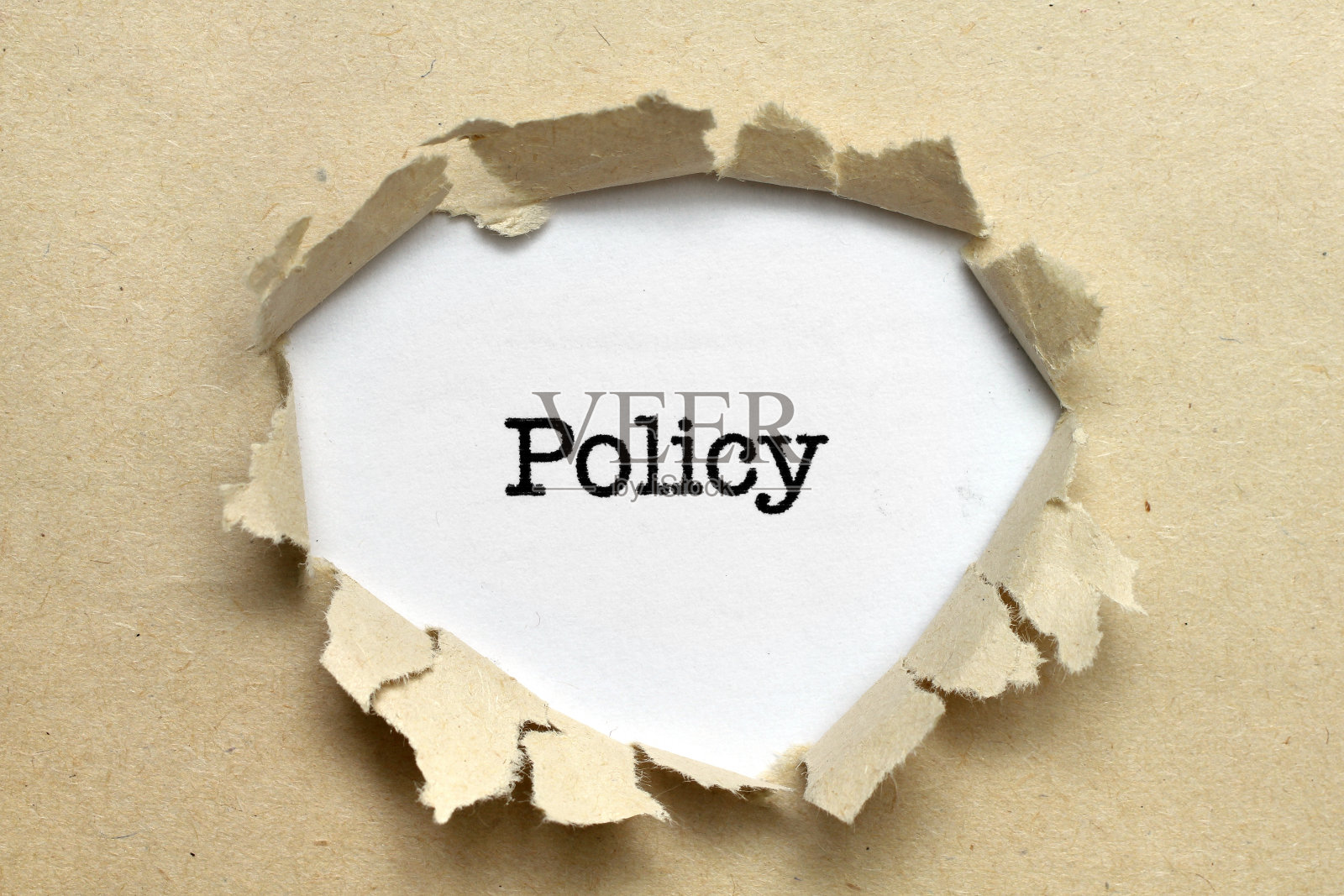 政策文本在纸洞上照片摄影图片