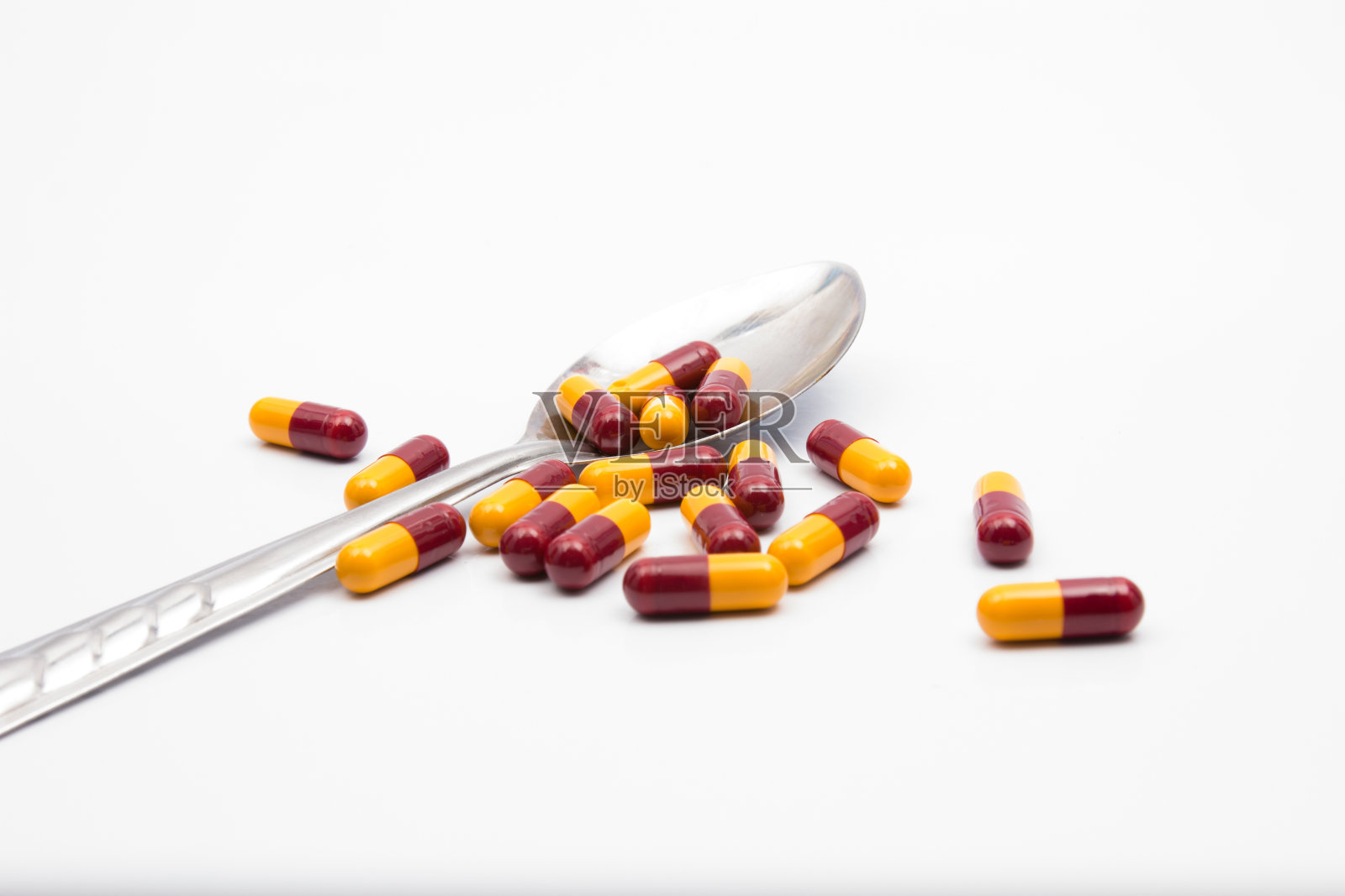 彩色胶囊勺照片摄影图片