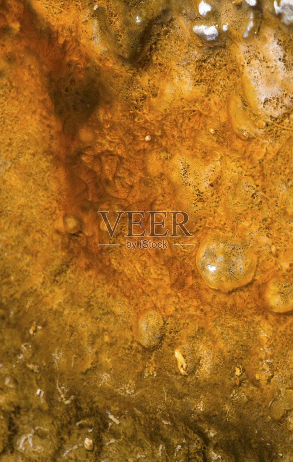 黄石国家地热池中的抽象橙色图案照片摄影图片