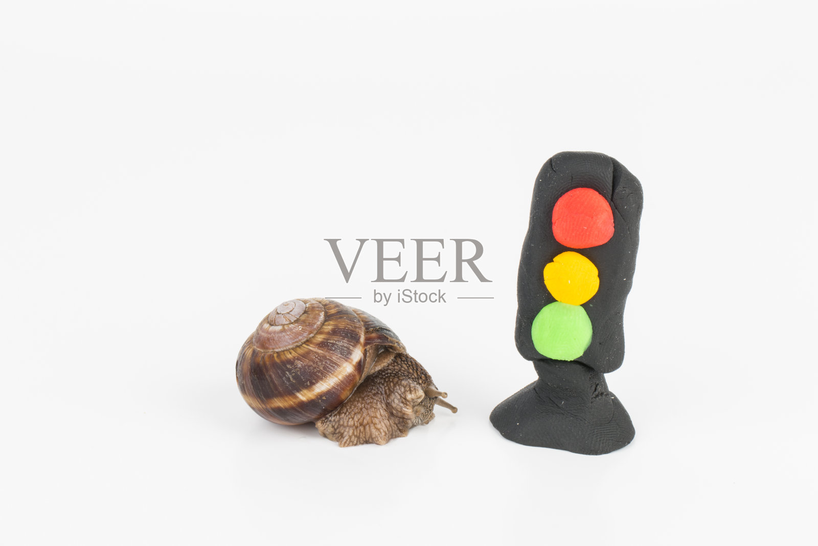 蜗牛和橡皮泥红绿灯。照片摄影图片