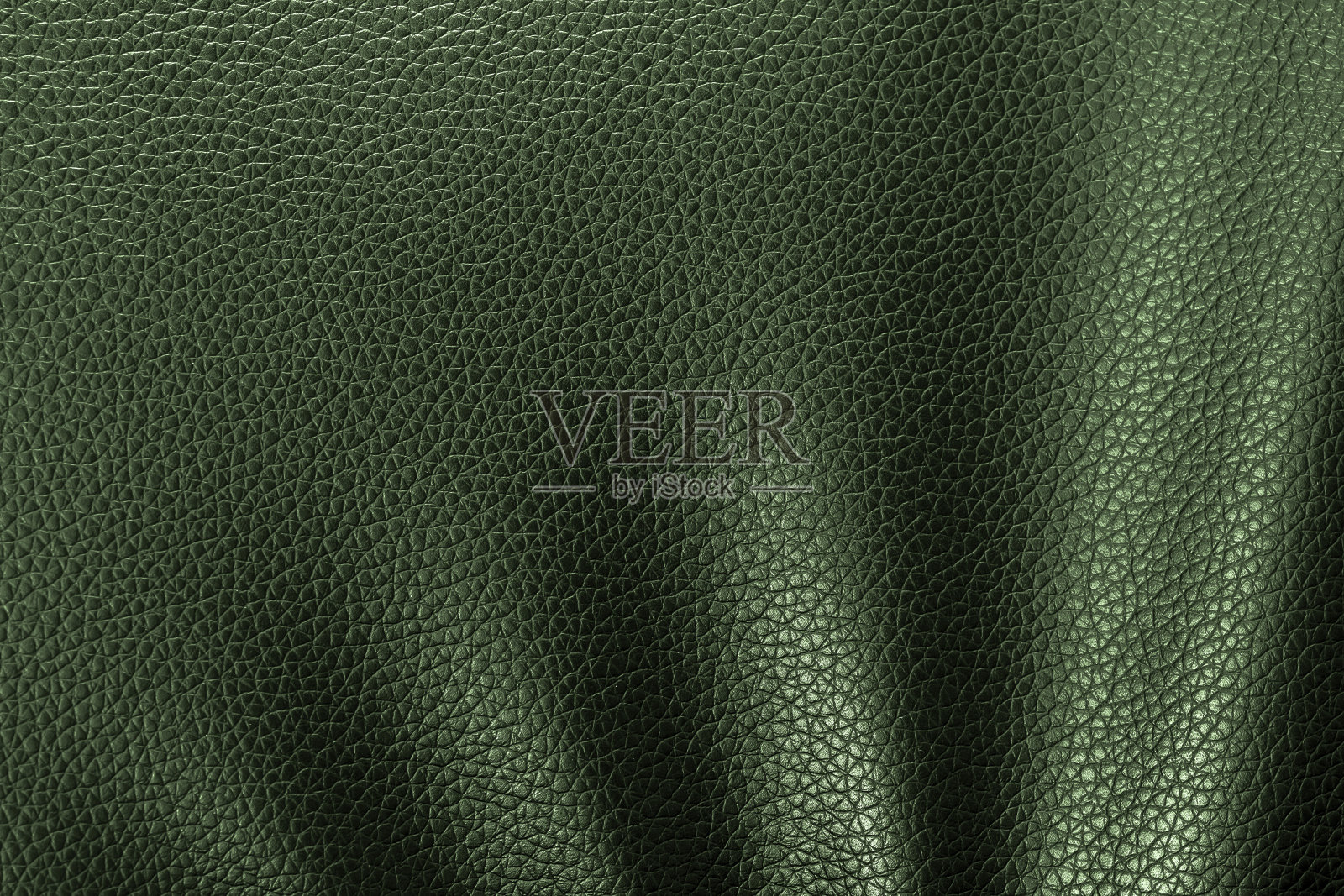 特写绿色皮革纹理。皮革的背景。照片摄影图片