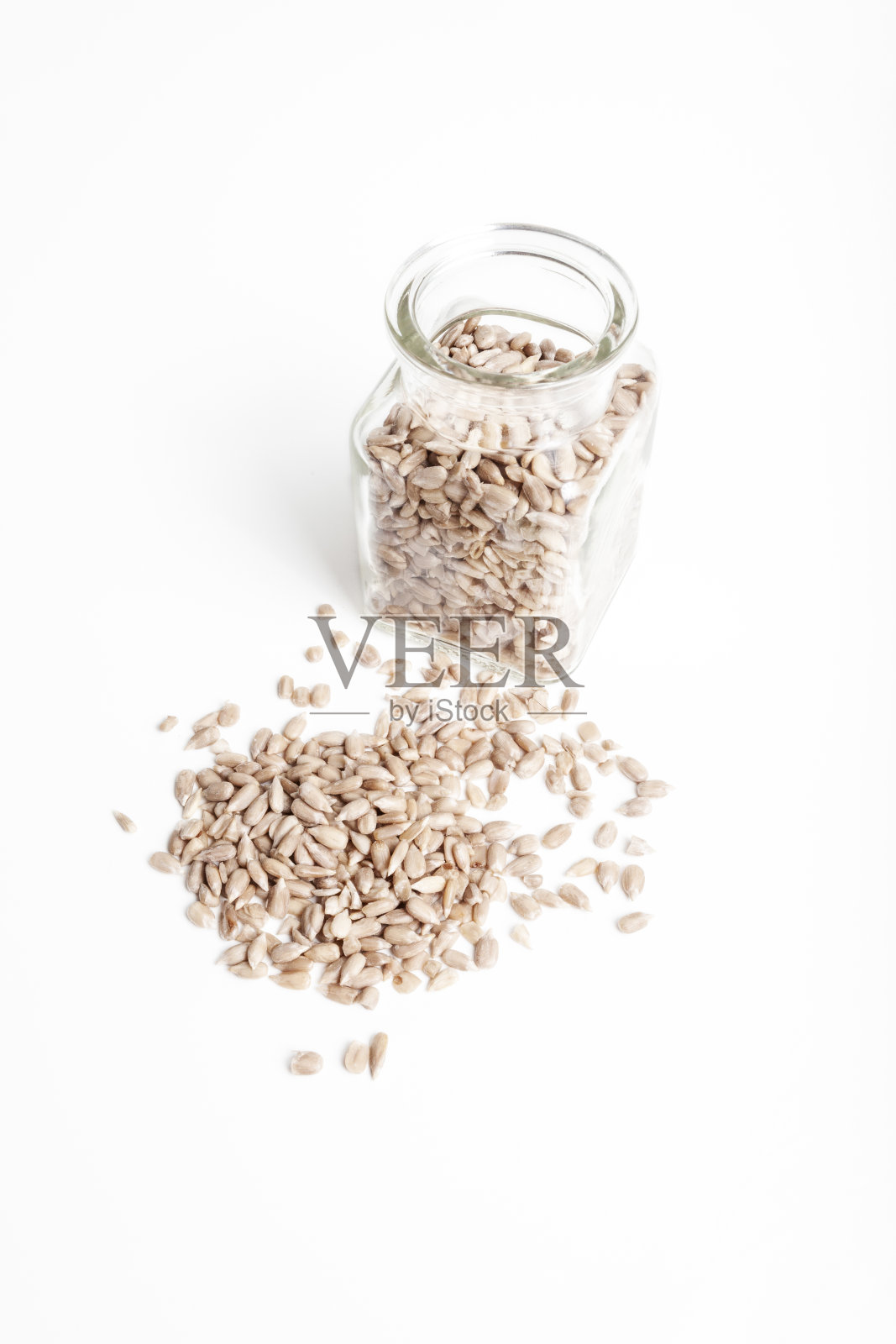 罐子里的葵花籽。照片摄影图片