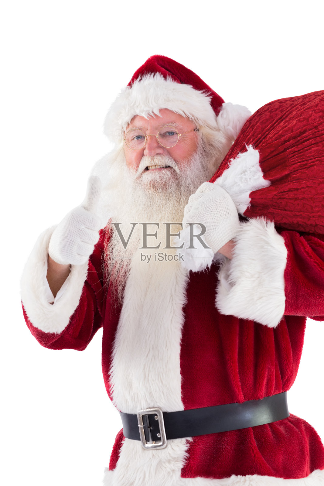 圣诞老人喜欢背着他的袋子照片摄影图片