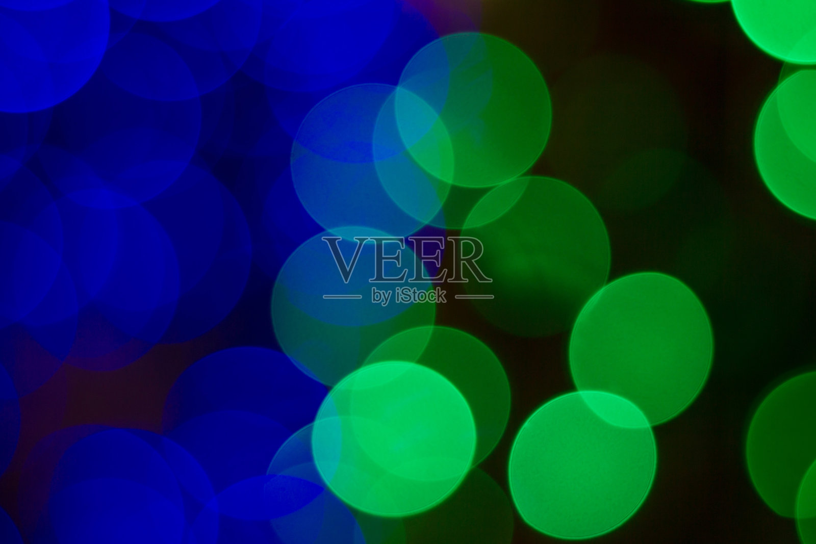 背景为绿色和蓝色的散景照片摄影图片